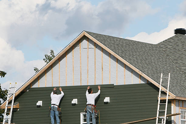 Professional Storm Damage Siding Repair technician working in Sparta, IL
